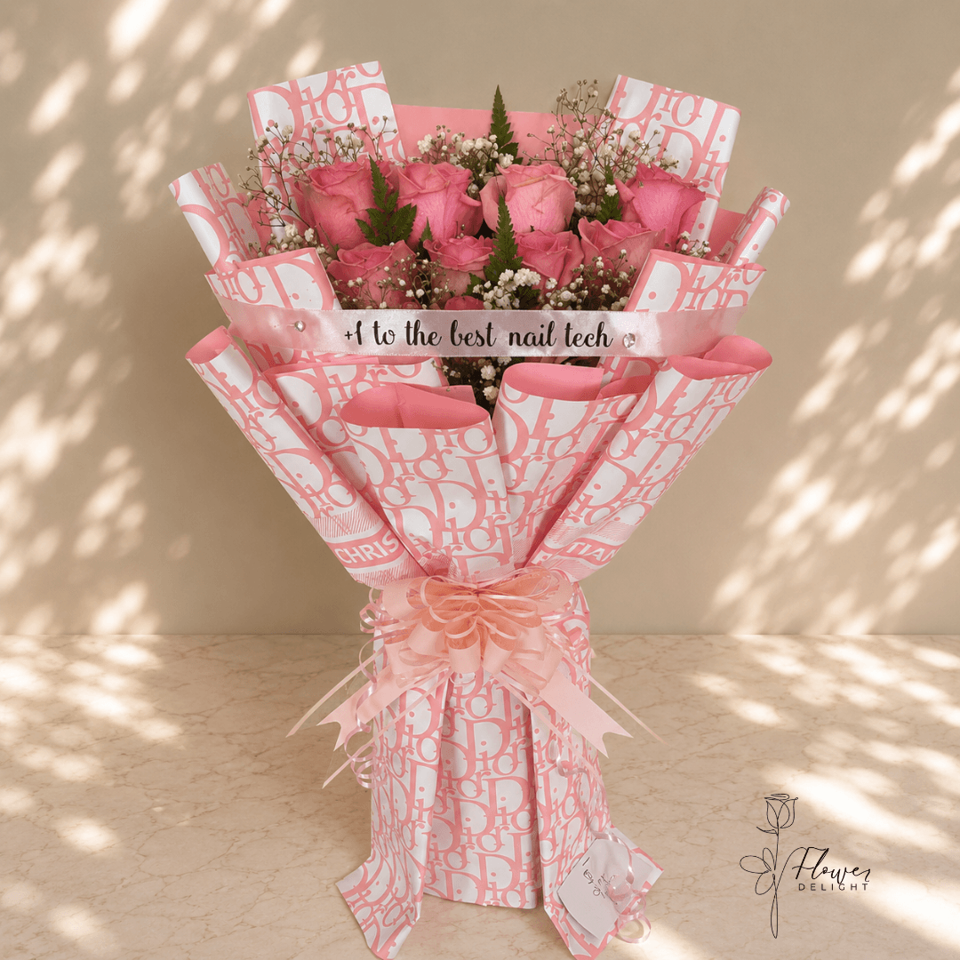 12 Pink Roses with Pink Dior Wrapping by Flower Delight