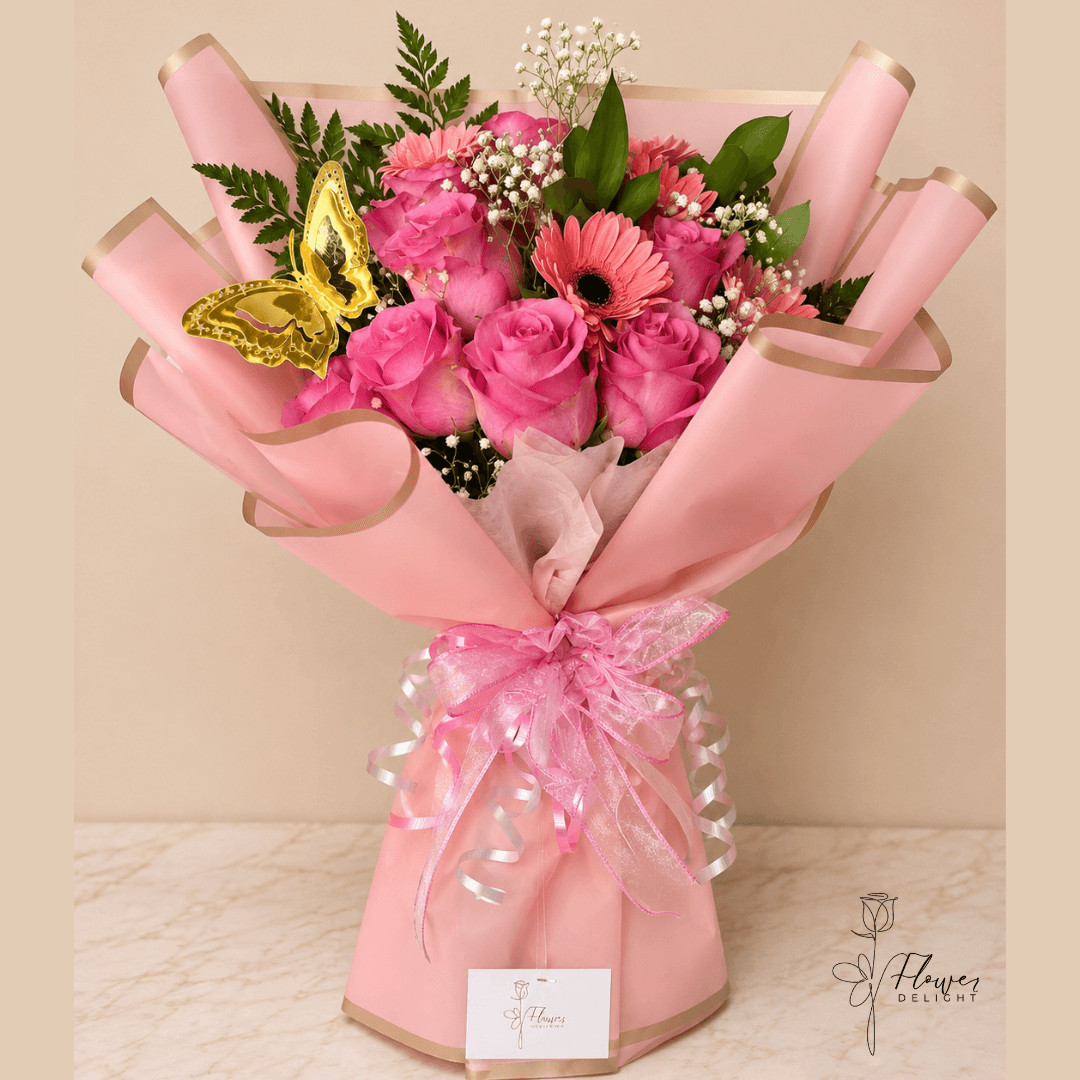 12 Pink Roses and Gerbera with Pink Wrapping by Flower Delight