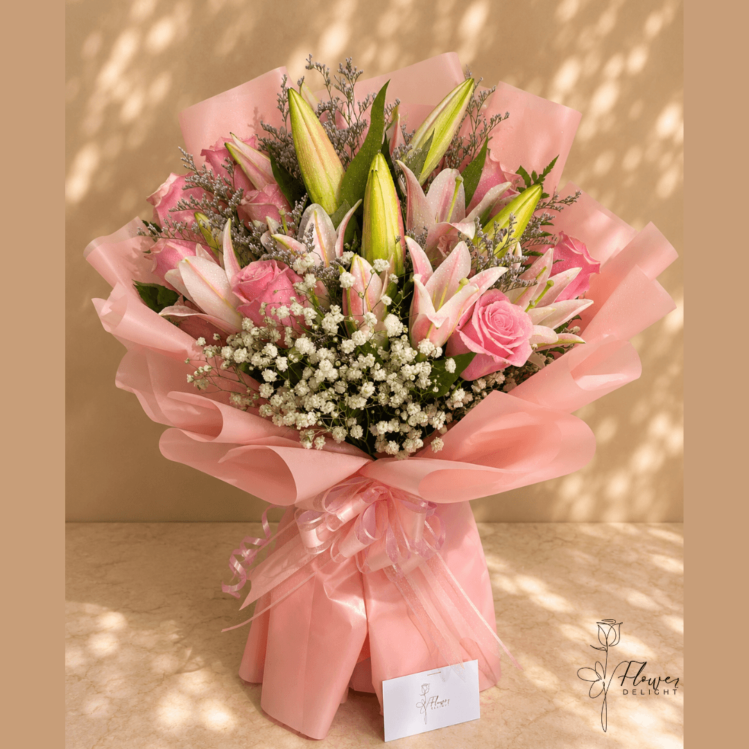 12 Pink Roses and Pink Lilies with Pink Wrapping by Flower Delight