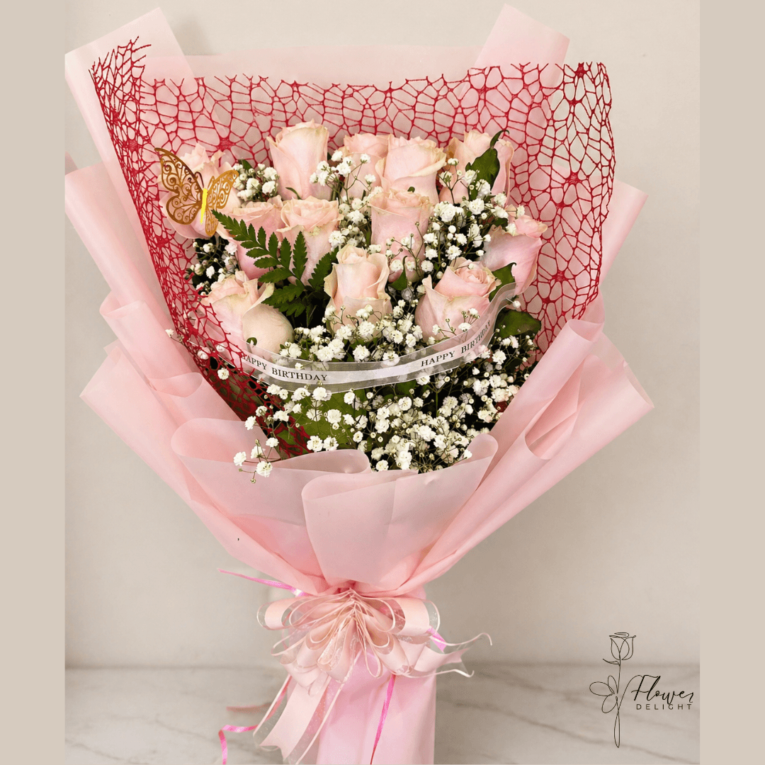 12 Pink Roses with Pink Wrapping by Flower Delight