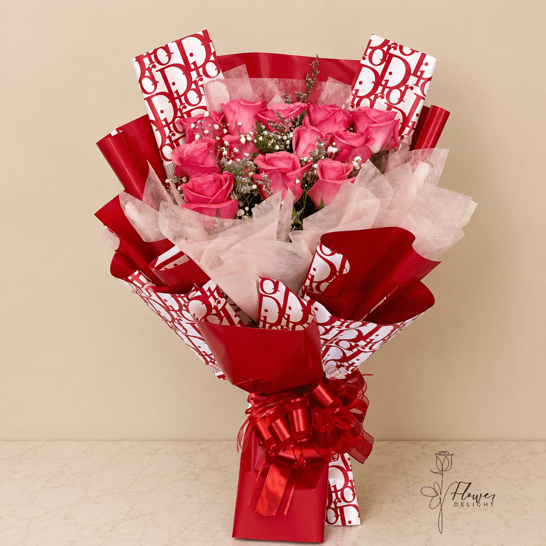 12 Pink Roses with Red Dior Wrapping by Flower Delight