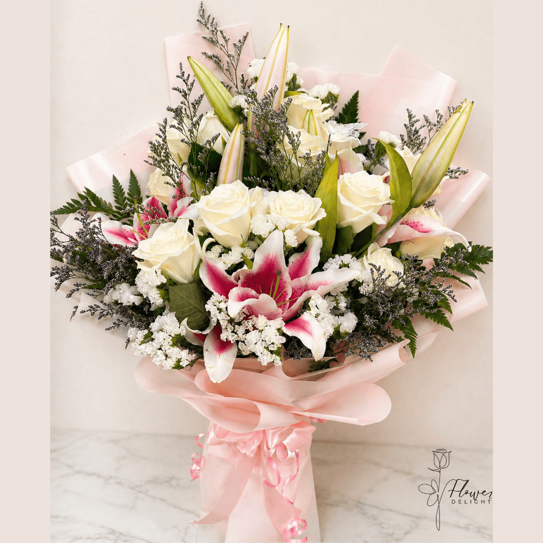 12 White Roses and Pink Lilies with Pink Wrapping by Flower Delight
