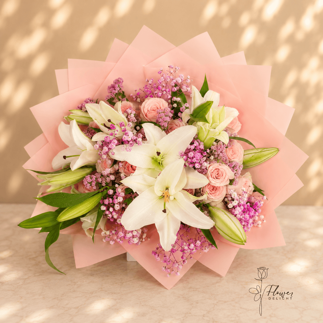 24 Pink Roses and White Lilies with Pink Wrapping by Flower Delight