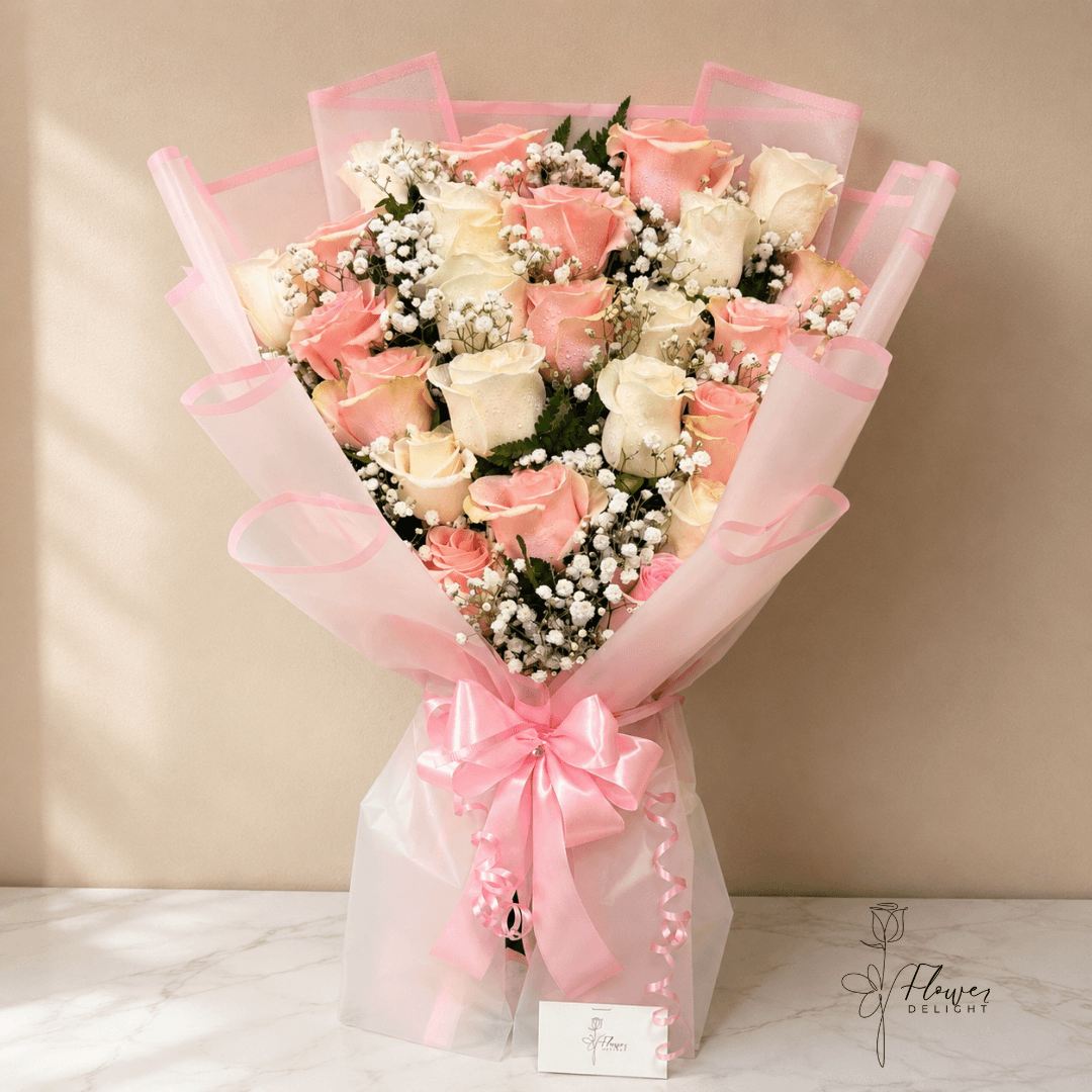 24 White and Pink Roses with Clear Pink Wrapping by Flower Delight