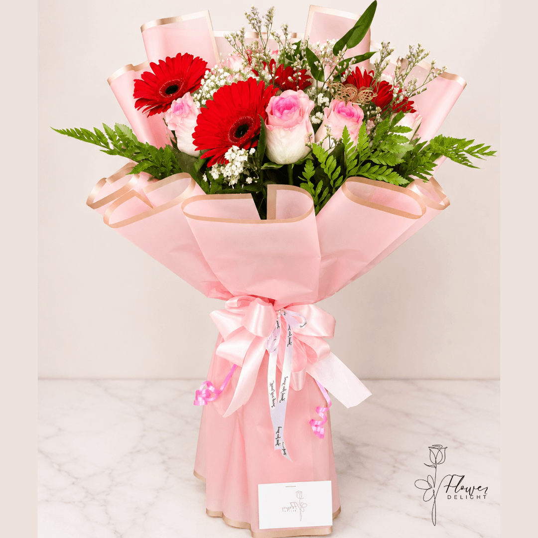 6 Pink Roses and Red Gerbera with Pink Wrapping by Flower Delight