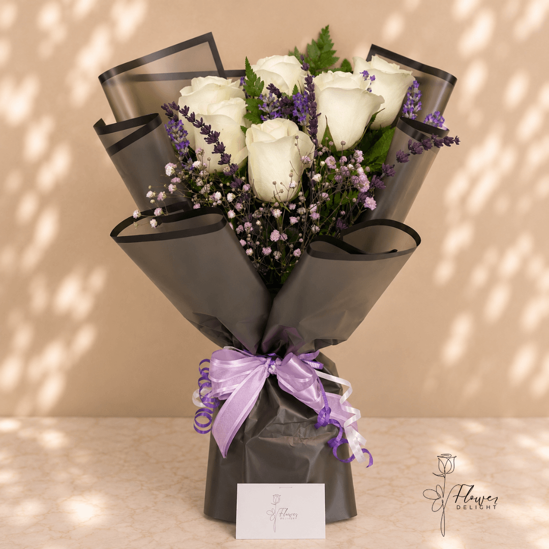 6 White Roses with Clear Black Wrapping by Flower Delight