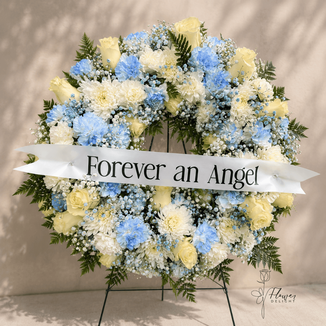 Blue and White Funeral Arrangement by Flower Delight